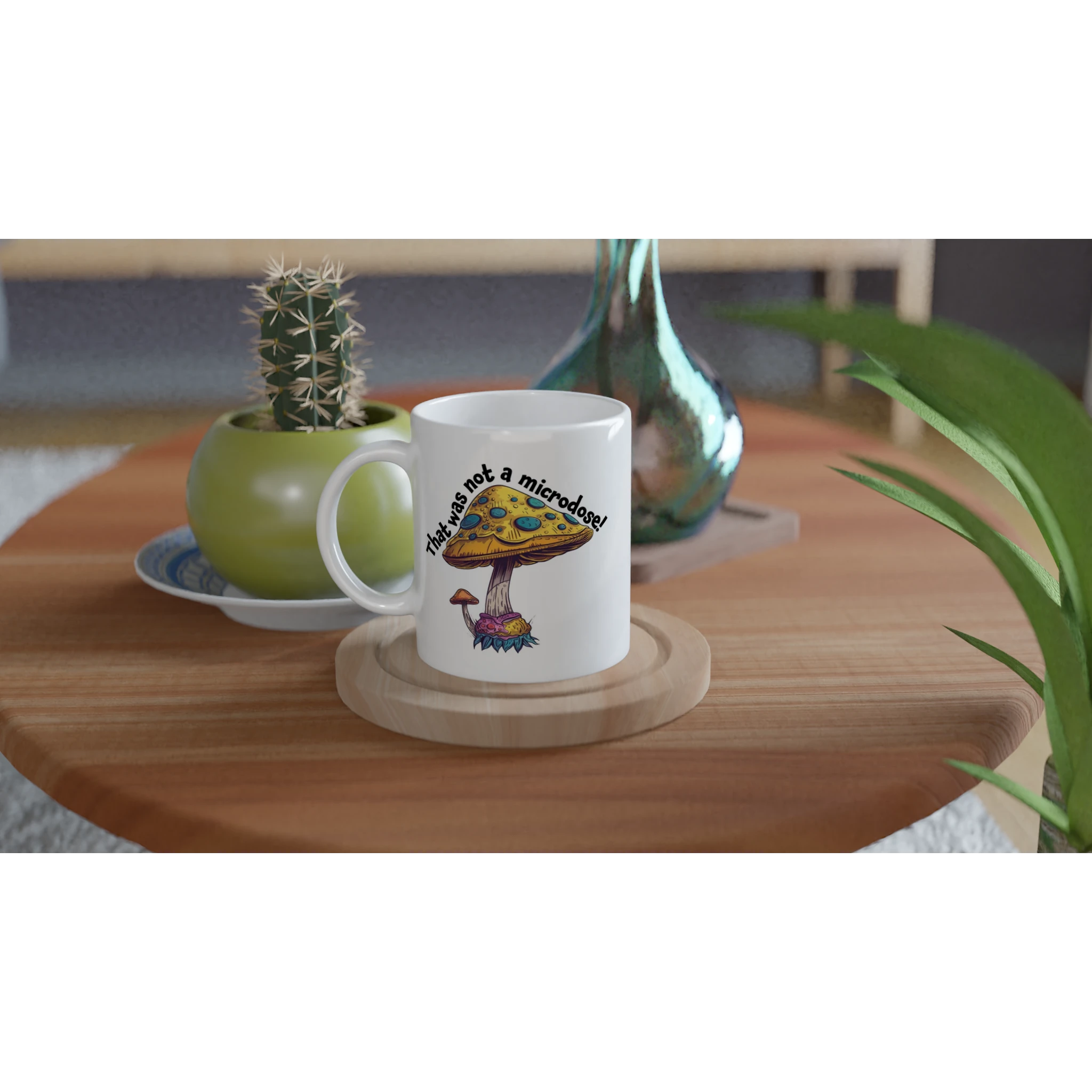 White ceramic mug with a funny Not a Microdose mushroom design on a table in a home setting