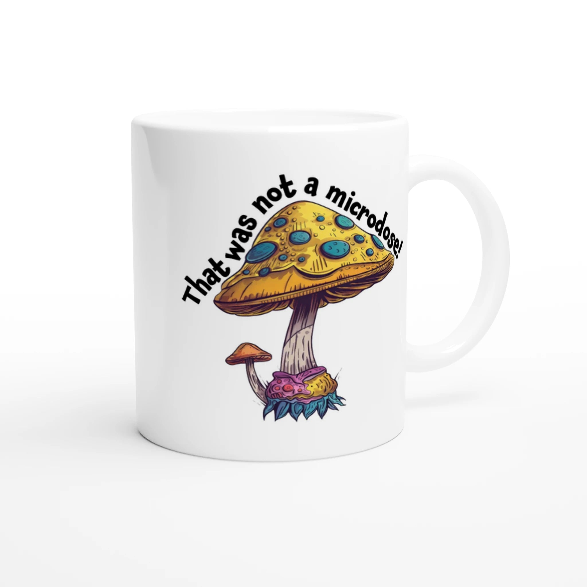 Side view of white ceramic mug with a humorous Not a Microdose mushroom design